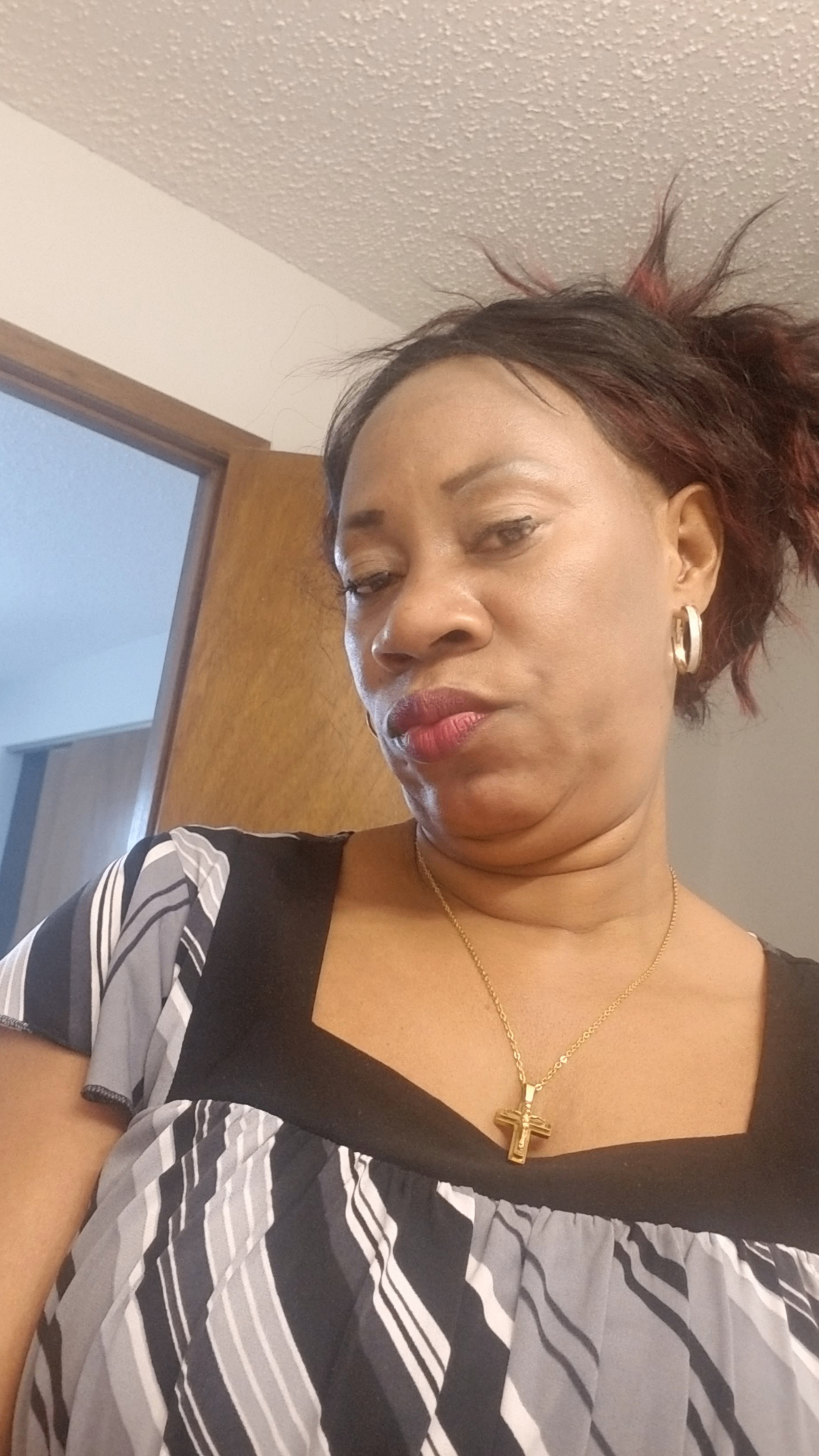 Diana, owner and stylist at D-Love Hair Braiding Center